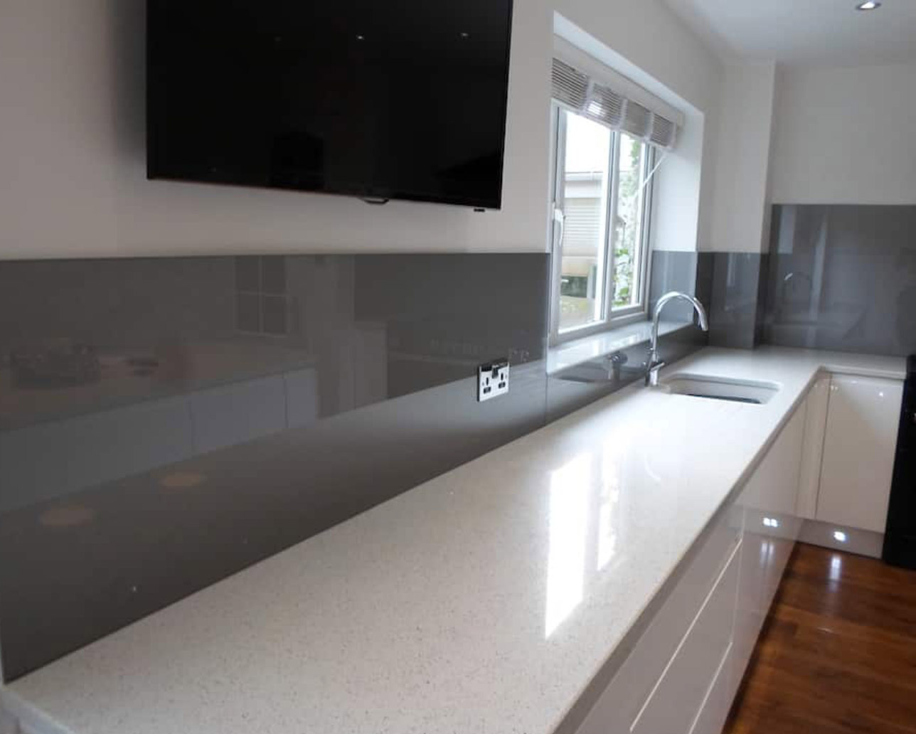 grey glass splashback above countertop