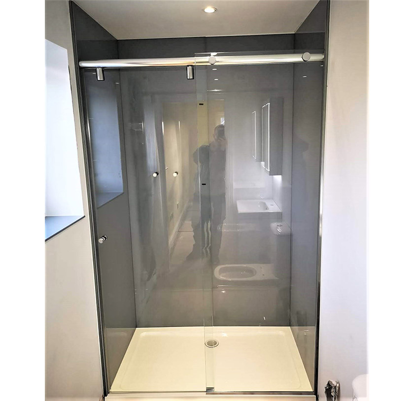 Glass sliding shower screen with stainless steel rail