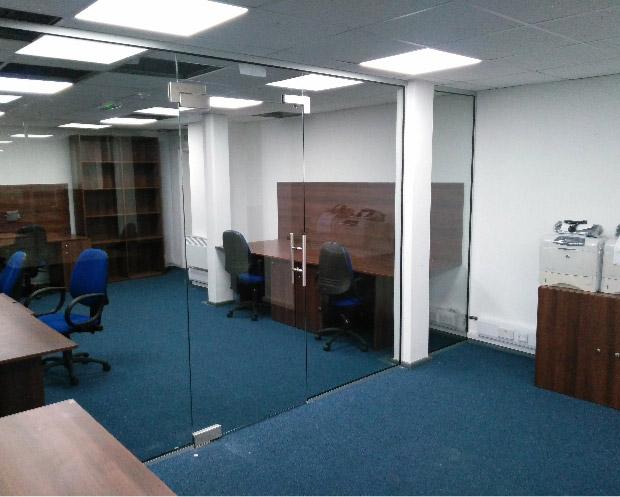 Floor to ceiling glass office partitions and door