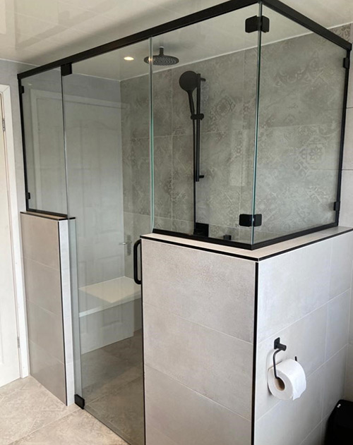 Glass shower screen with black frame
