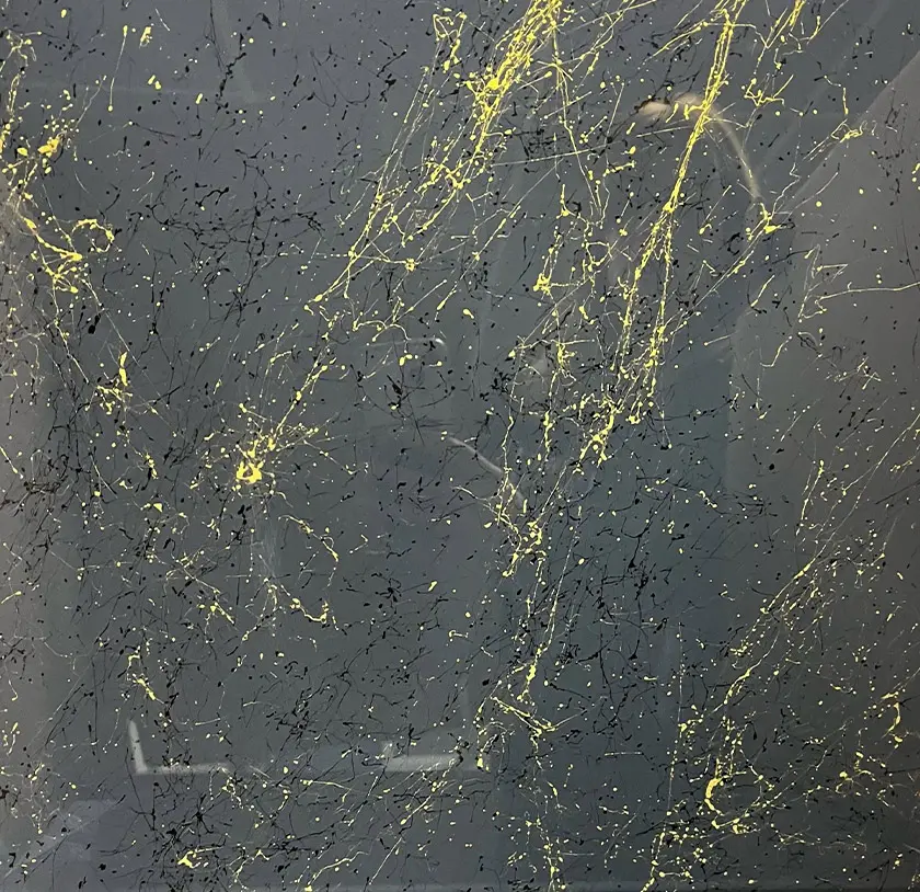 Grey, gold and black stone marble effect glass splashback, with the gold prominent