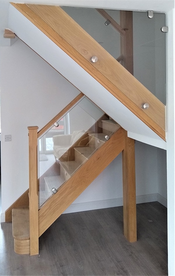 Glass balustrade with wooden banister