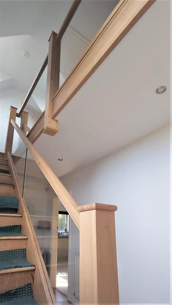 Glass balustrade and banister surround with wooden posts